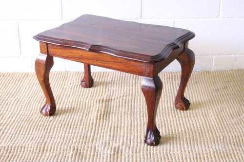 A beautiful vintage scalloped edge solid African Stink wood ball and claw coffee/ side table