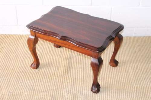 A beautiful vintage scalloped edge solid African Stink wood ball and claw coffee/ side table