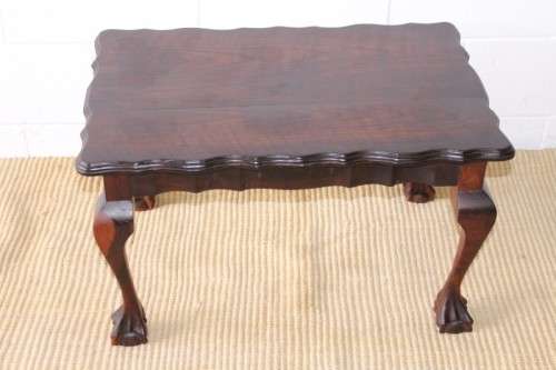 A great size vintage scalloped edge solid African Stink wood ball and claw coffee/ side table