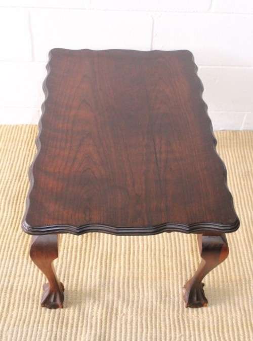 A great size vintage scalloped edge solid African Stink wood ball and claw coffee/ side table