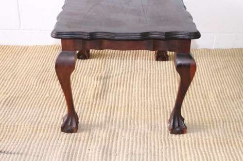 A great size vintage scalloped edge solid African Stink wood ball and claw coffee/ side table