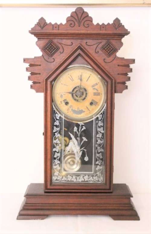 A beautiful and rare hand carved antique Ansonia "Gingerbread" shelf mantle clock with alarm bell
