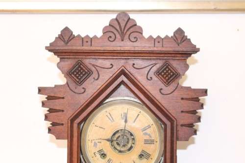 A beautiful and rare hand carved antique Ansonia "Gingerbread" shelf mantle clock with alarm bell