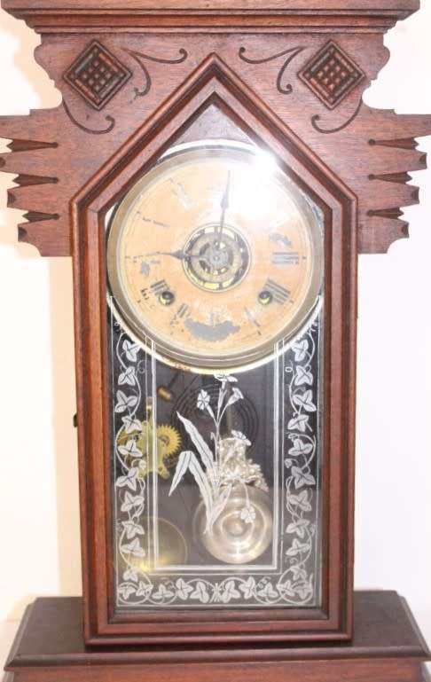 A beautiful and rare hand carved antique Ansonia "Gingerbread" shelf mantle clock with alarm bell