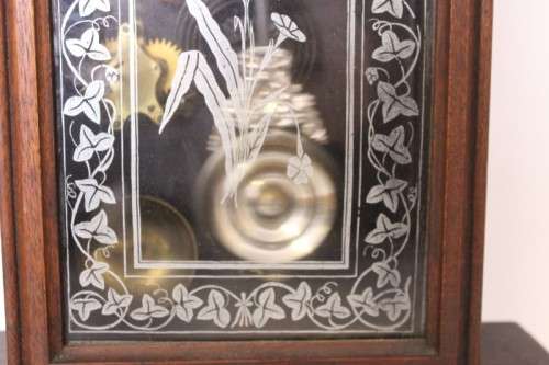 A beautiful and rare hand carved antique Ansonia "Gingerbread" shelf mantle clock with alarm bell