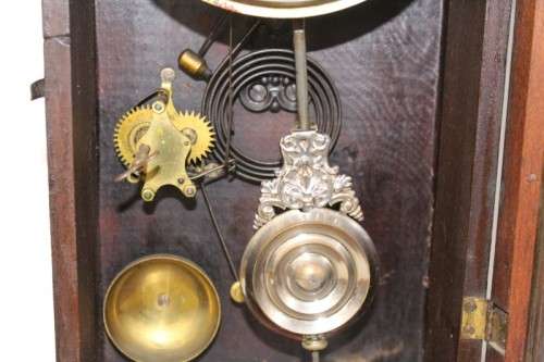 A beautiful and rare hand carved antique Ansonia "Gingerbread" shelf mantle clock with alarm bell