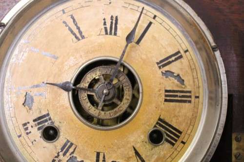 A beautiful and rare hand carved antique Ansonia "Gingerbread" shelf mantle clock with alarm bell