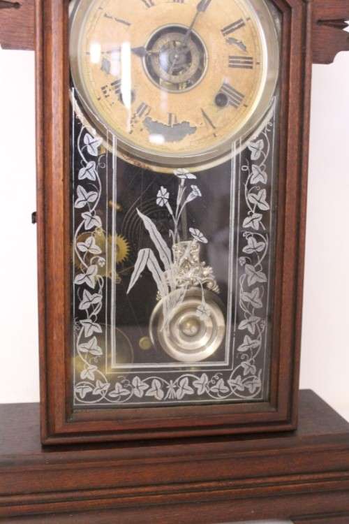 A beautiful and rare hand carved antique Ansonia "Gingerbread" shelf mantle clock with alarm bell