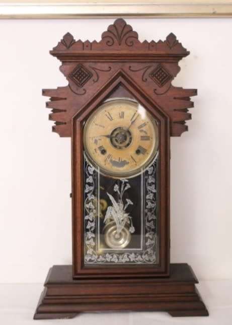 A beautiful and rare hand carved antique Ansonia "Gingerbread" shelf mantle clock with alarm bell