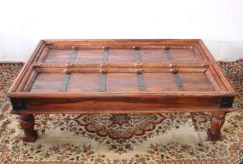 A fantastic solid Indonesian Teak carved centre coffee table w/ substantial legs and metal detailing