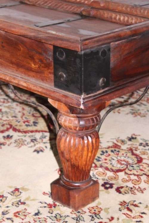 A fantastic solid Indonesian Teak carved centre coffee table w/ substantial legs and metal detailing