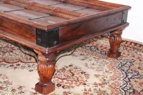 A fantastic solid Indonesian Teak carved centre coffee table w/ substantial legs and metal detailing