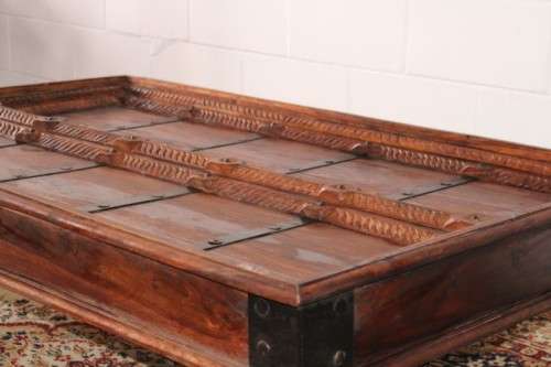 A fantastic solid Indonesian Teak carved centre coffee table w/ substantial legs and metal detailing