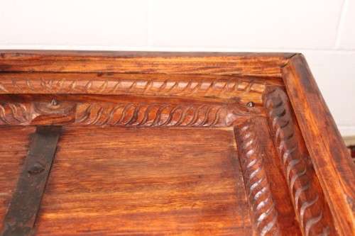 A fantastic solid Indonesian Teak carved centre coffee table w/ substantial legs and metal detailing