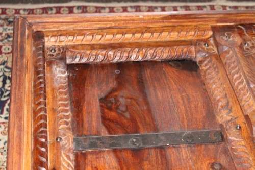 A fantastic solid Indonesian Teak carved centre coffee table w/ substantial legs and metal detailing