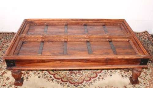 A fantastic solid Indonesian Teak carved centre coffee table w/ substantial legs and metal detailing