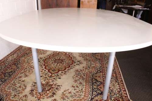 A large oval modern styled, grey painted 8 to 10-seater boardroom table on a sturdy metal frame