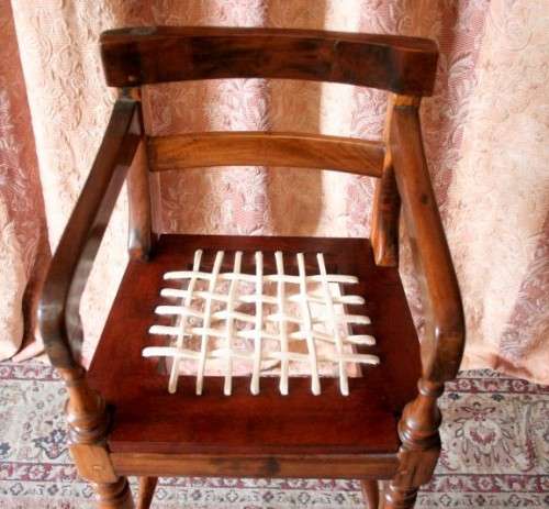 A beautifully hand made riempie baby high chair w/ white leather riempies & turned front legs