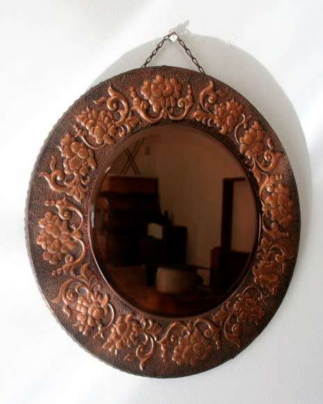 A superb antique ornately moulded copper framed round pink bevelled glass wall mirror - wow!!