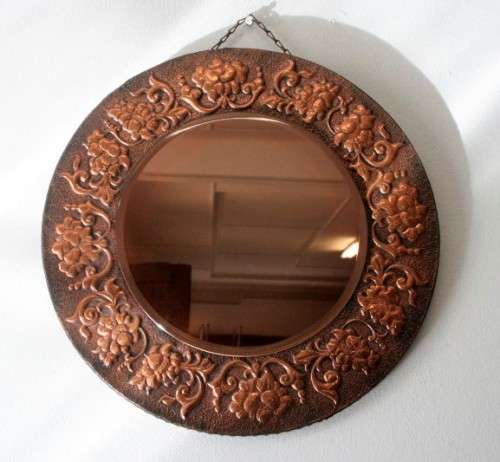 A superb antique ornately moulded copper framed round pink bevelled glass wall mirror - wow!!