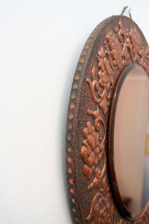 A superb antique ornately moulded copper framed round pink bevelled glass wall mirror - wow!!