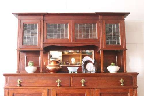 A spectacular antique Victorian honeyed-oak lead-glass door hutch buffet/ side server cabinet