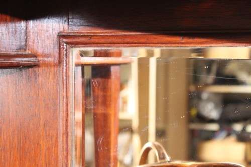 A spectacular antique Victorian honeyed-oak lead-glass door hutch buffet/ side server cabinet