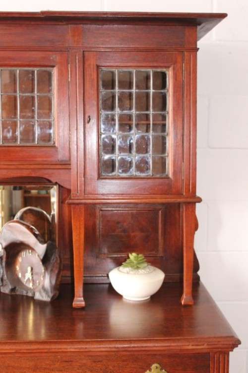 A spectacular antique Victorian honeyed-oak lead-glass door hutch buffet/ side server cabinet
