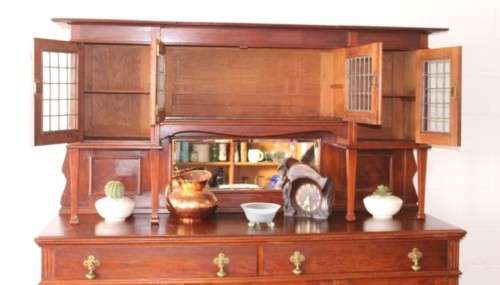 A spectacular antique Victorian honeyed-oak lead-glass door hutch buffet/ side server cabinet