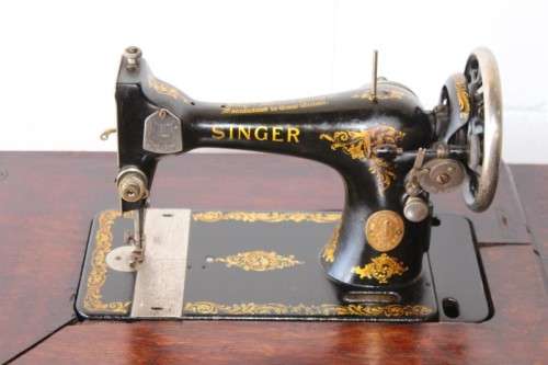 Stunning antique 1937 Singer treadle sewing machine in its original fold-away cast-iron & oak stand