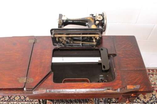Stunning antique 1937 Singer treadle sewing machine in its original fold-away cast-iron & oak stand
