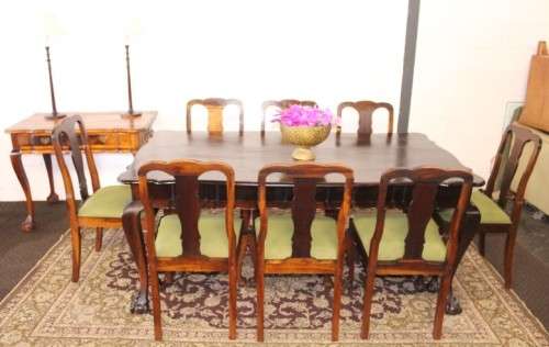 A solid blackwood scalloped edge ball & claw 8-seater dining suite with a separate cutlery table