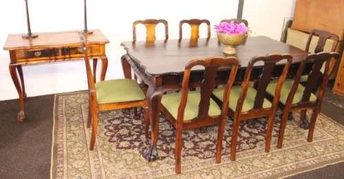 A solid blackwood scalloped edge ball & claw 8-seater dining suite with a separate cutlery table