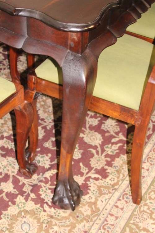 A solid blackwood scalloped edge ball & claw 8-seater dining suite with a separate cutlery table