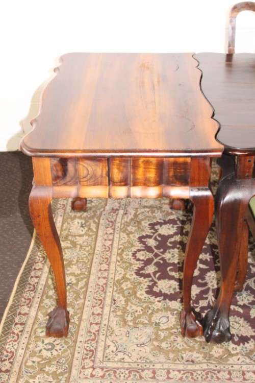 A solid blackwood scalloped edge ball & claw 8-seater dining suite with a separate cutlery table