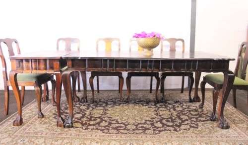 A solid blackwood scalloped edge ball & claw 8-seater dining suite with a separate cutlery table