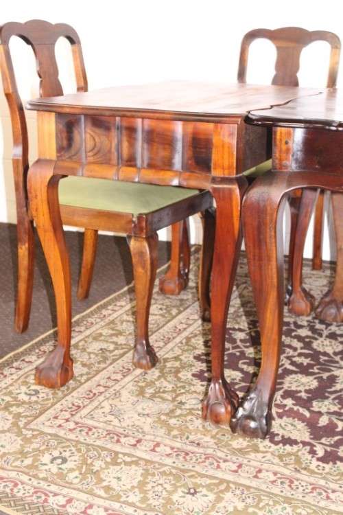 A solid blackwood scalloped edge ball & claw 8-seater dining suite with a separate cutlery table