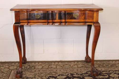 A solid blackwood scalloped edge ball & claw 8-seater dining suite with a separate cutlery table