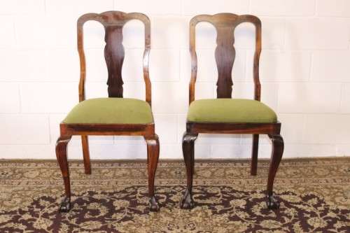 A solid blackwood scalloped edge ball & claw 8-seater dining suite with a separate cutlery table