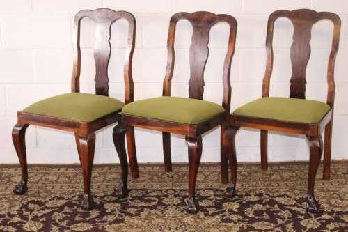 A solid blackwood scalloped edge ball & claw 8-seater dining suite with a separate cutlery table