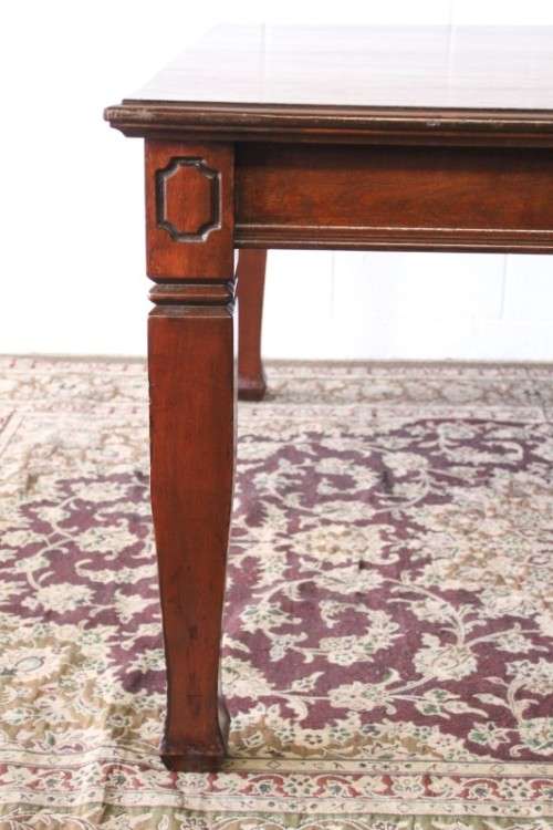 An awesome modern styled square 8-seater dining table with substantial table legs & carved detailing