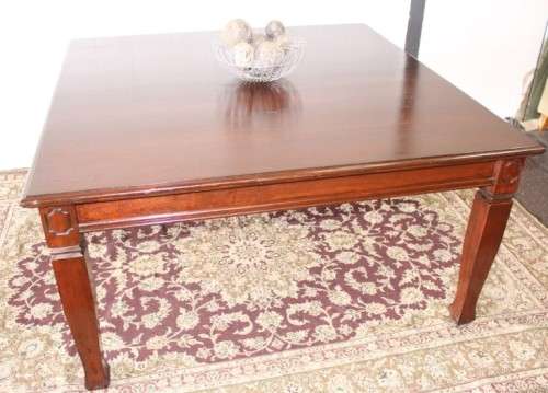 An awesome modern styled square 8-seater dining table with substantial table legs & carved detailing
