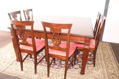 An awesome modern styled square 8-seater dining table with substantial table legs & carved detailing