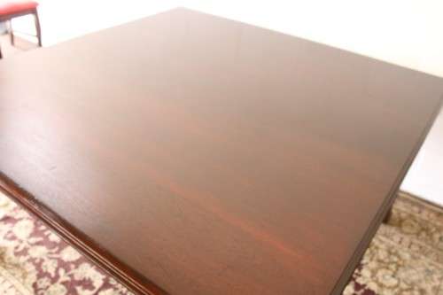 An awesome modern styled square 8-seater dining table with substantial table legs & carved detailing