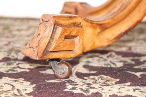 An incredible antique walnut & walnut burr carved loo table w/ marquetry inlay detailing on castors
