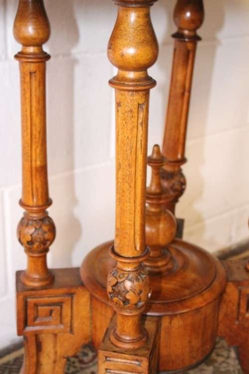 An incredible antique walnut & walnut burr carved loo table w/ marquetry inlay detailing on castors