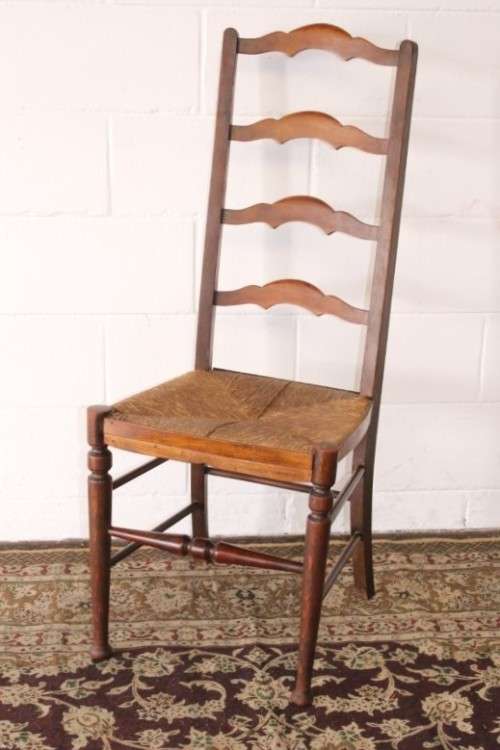 **RS17** A wonderful antique oak ladder-back dining/ occasional chair with a woven grass seat