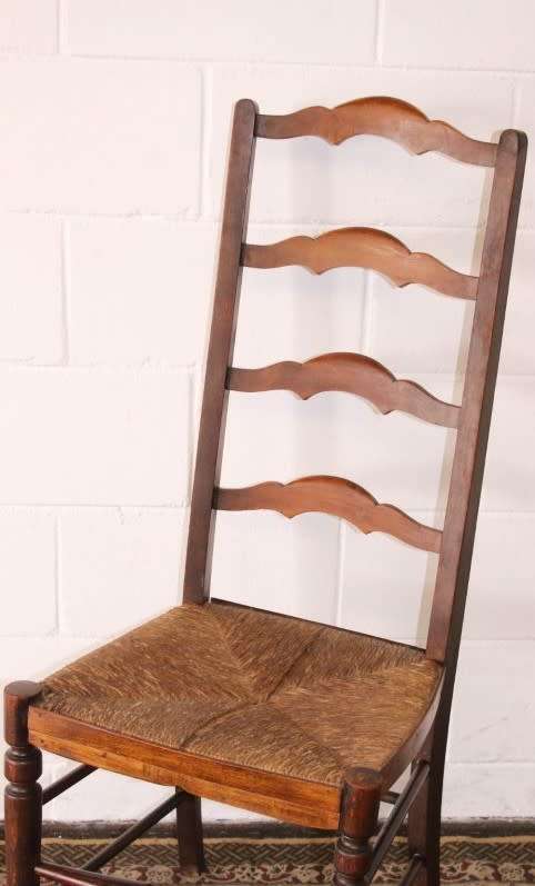 **RS17** A wonderful antique oak ladder-back dining/ occasional chair with a woven grass seat