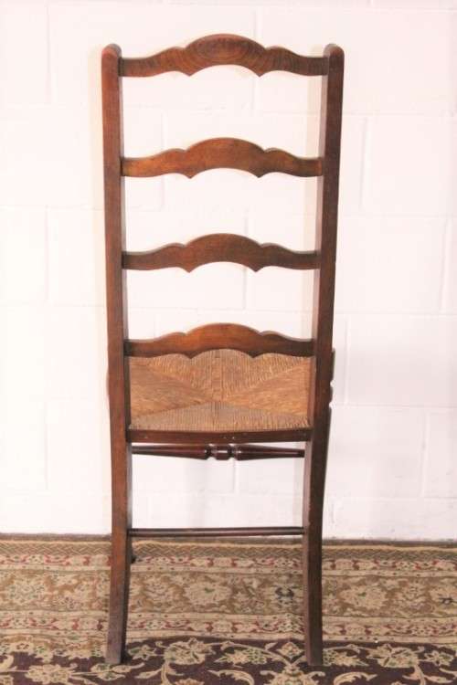 **RS17** A wonderful antique oak ladder-back dining/ occasional chair with a woven grass seat