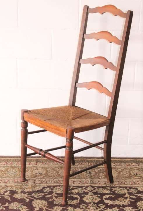 **RS17** A wonderful antique oak ladder-back dining/ occasional chair with a woven grass seat